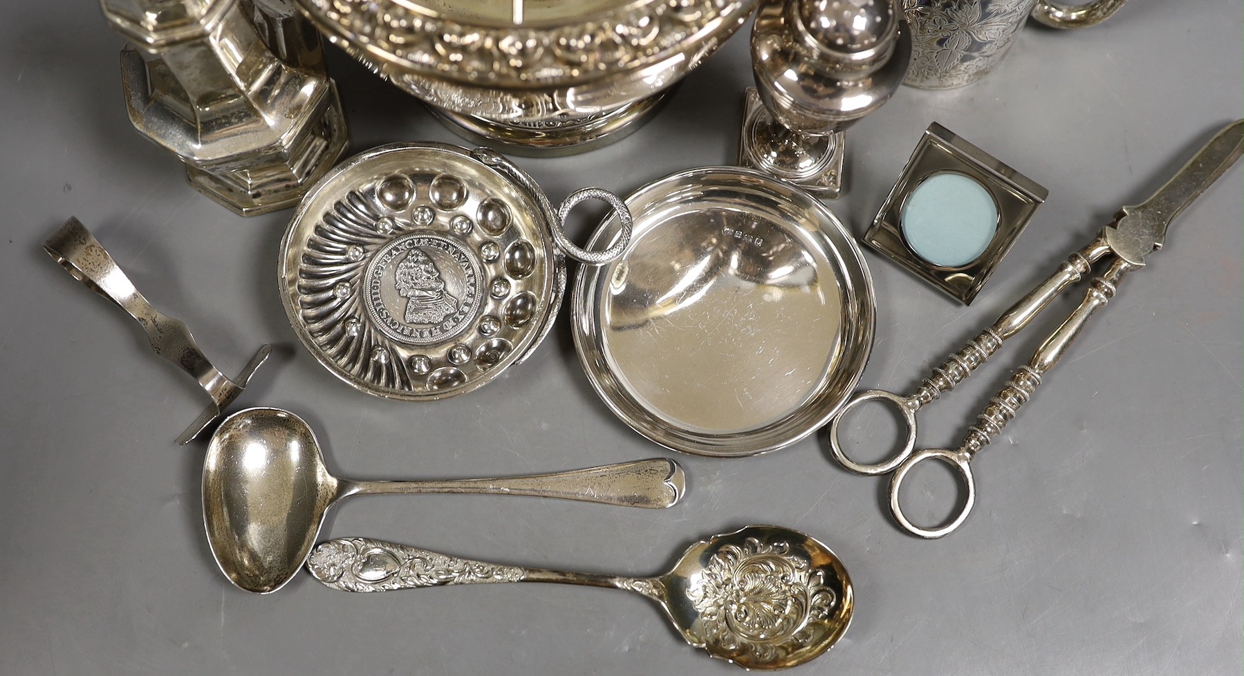 A George III silver vase shaped pepperette, Richard Evans? London, 1788, 88mm, a Victorian silver christening mug, a later silver sugar caster, a French white metal taste vin and other sundry silver and plated items.